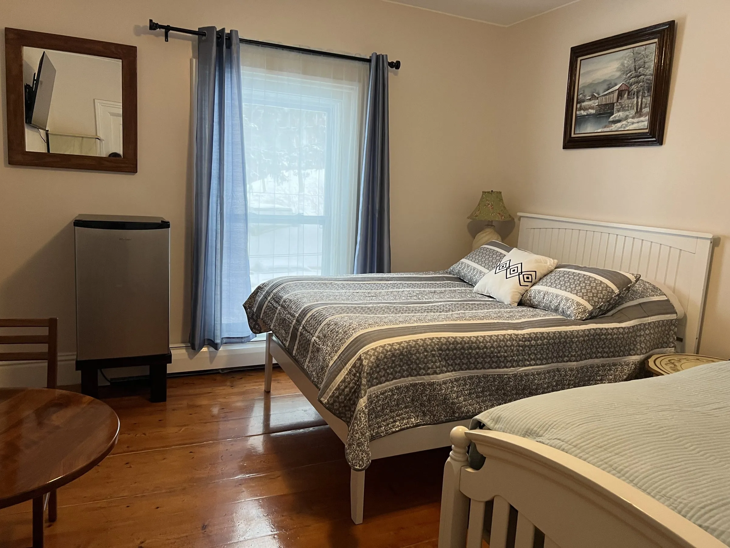 The two beds, lamp lit