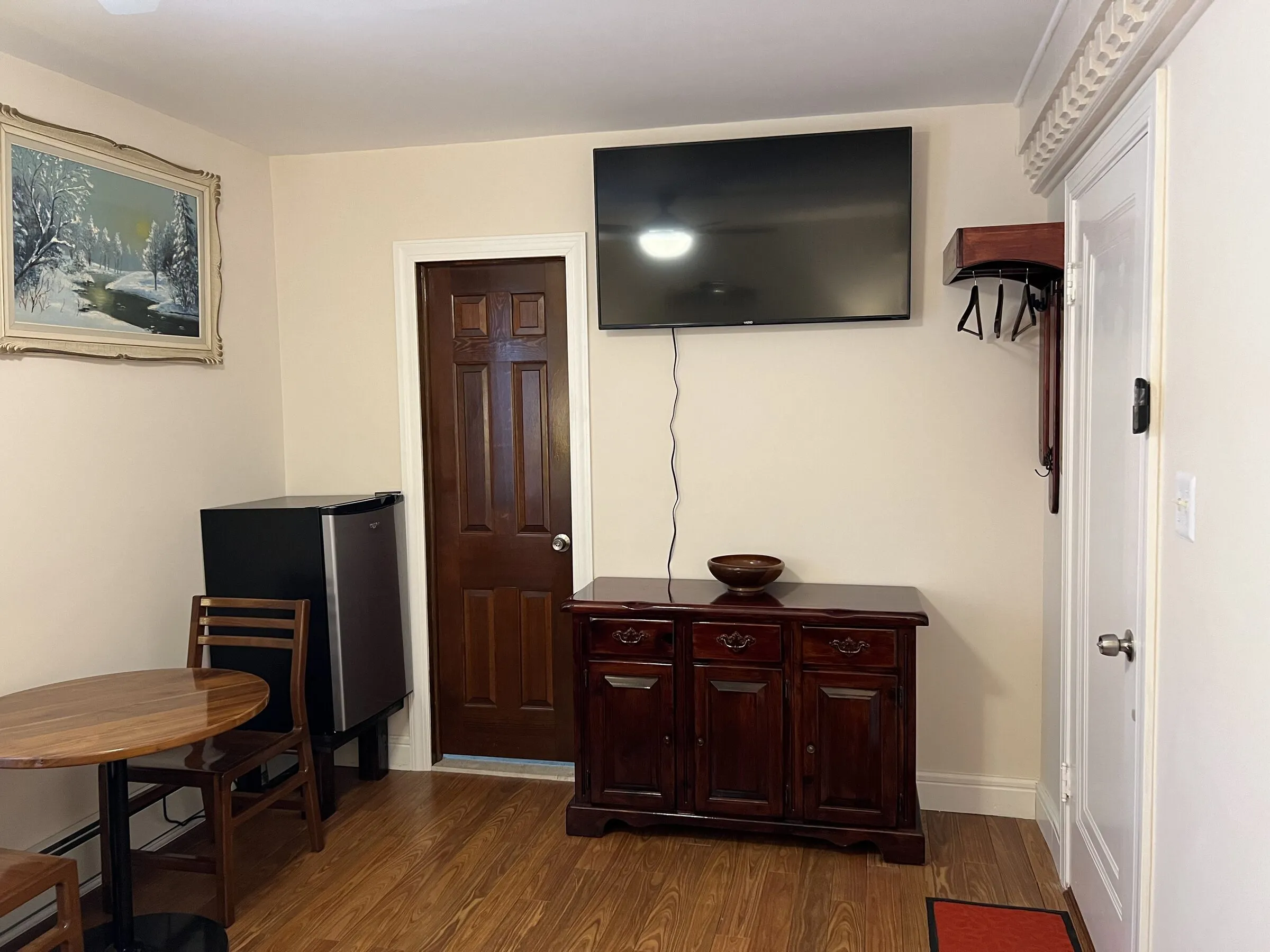 The sitting area, with mini-fridge and table for two
