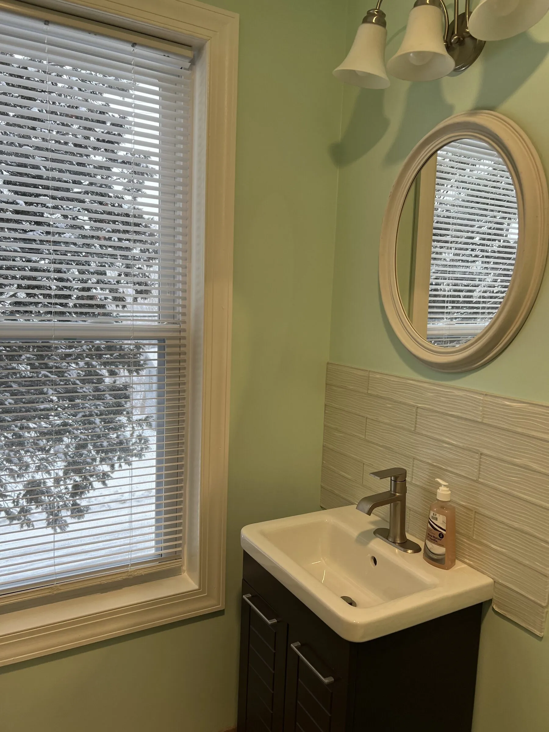 The vanity window, looking onto the pines