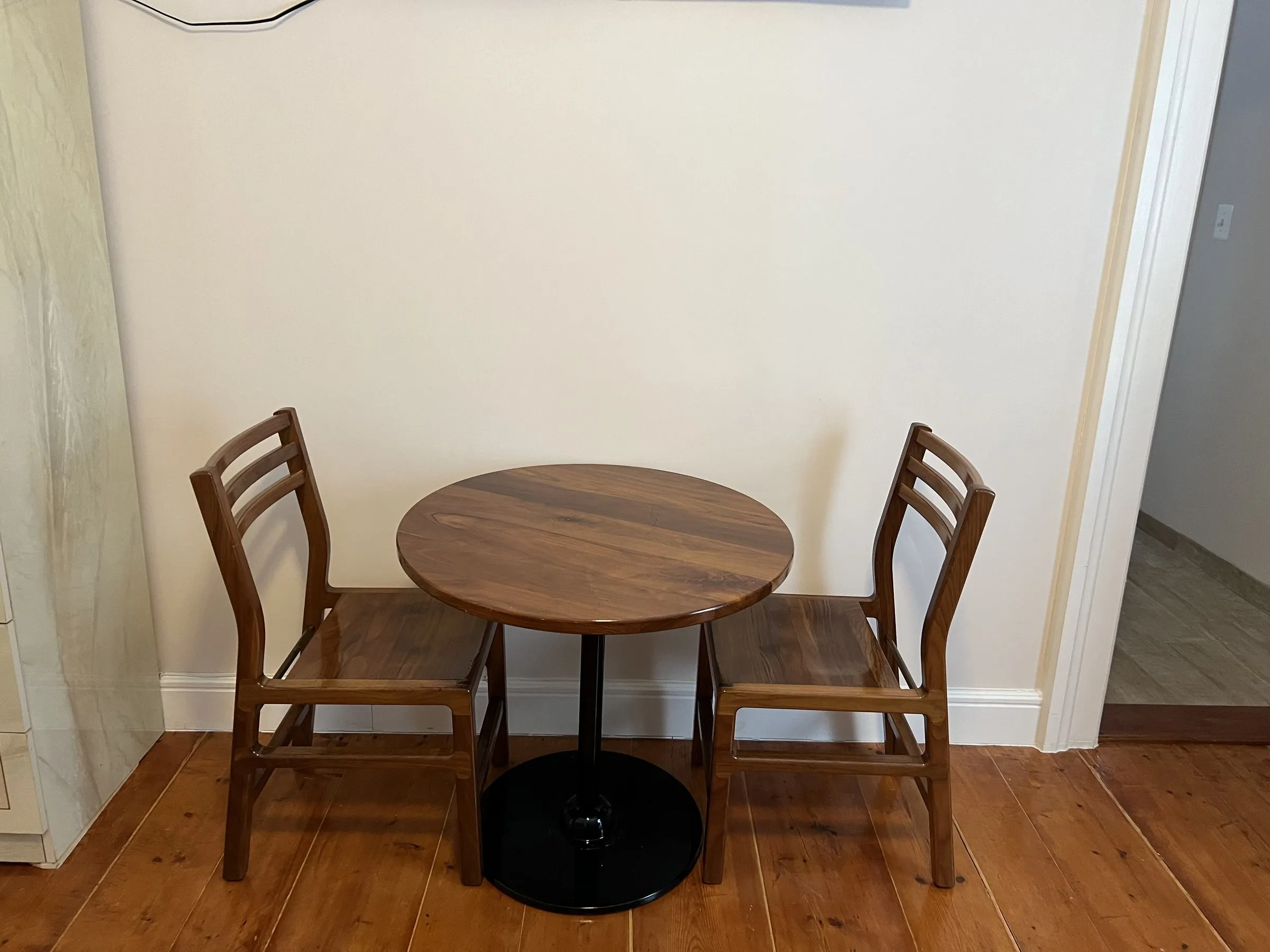 Walnut table and two chairs