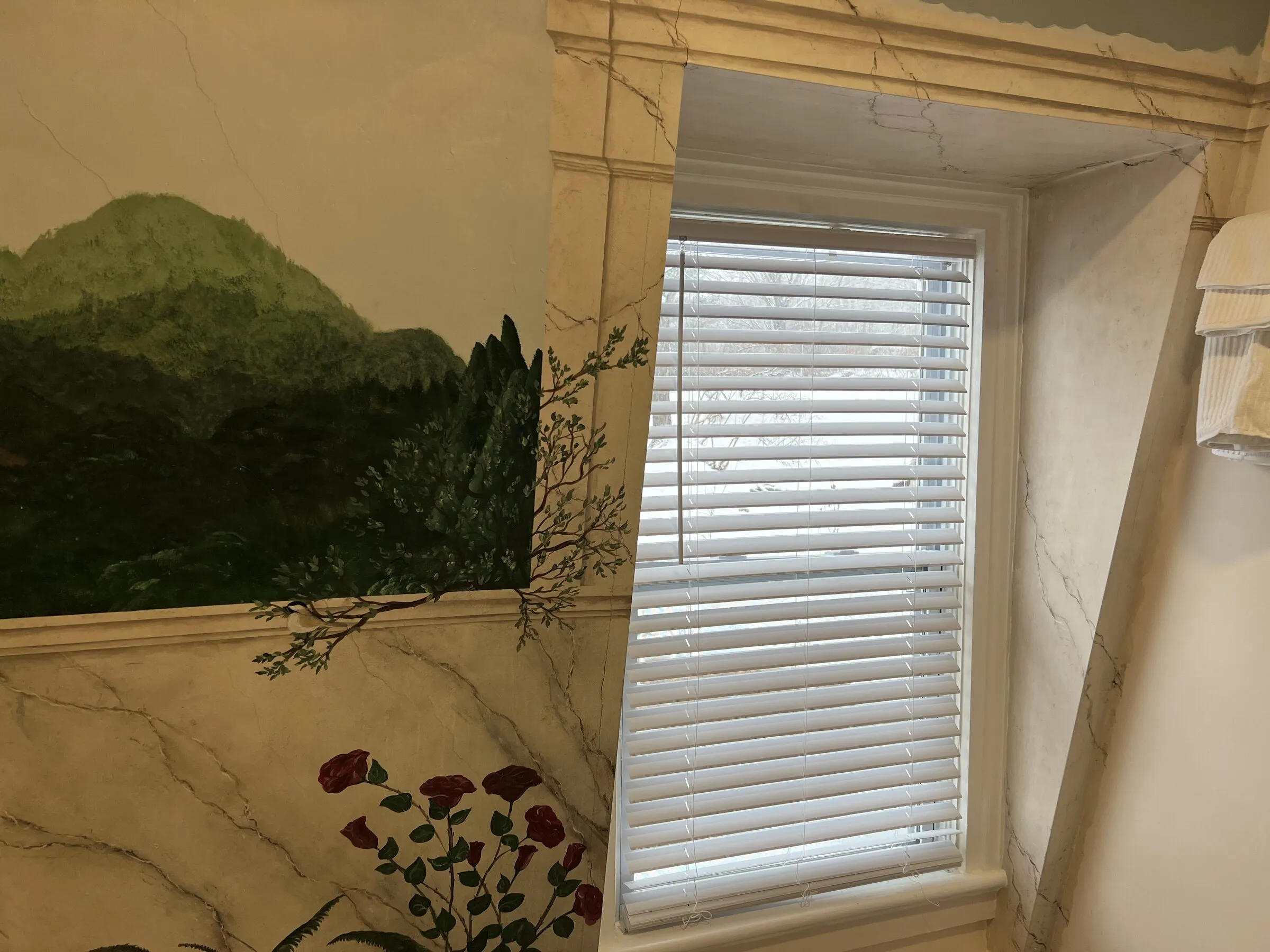 The hand-painted mural beside the bathroom window