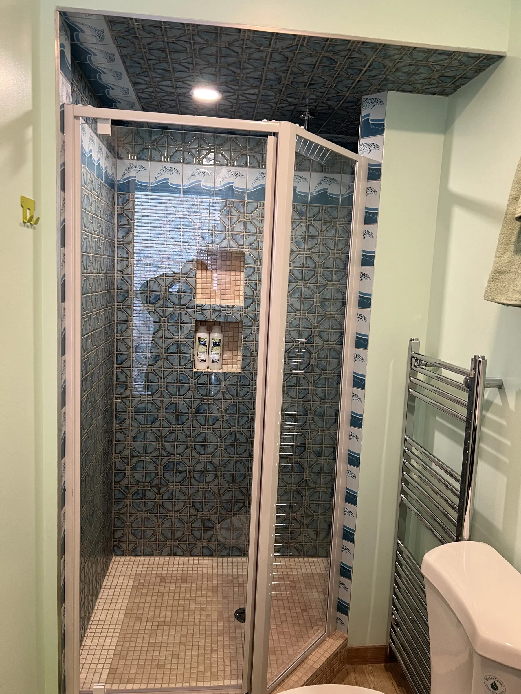 Tiled shower and a heated towel rail
