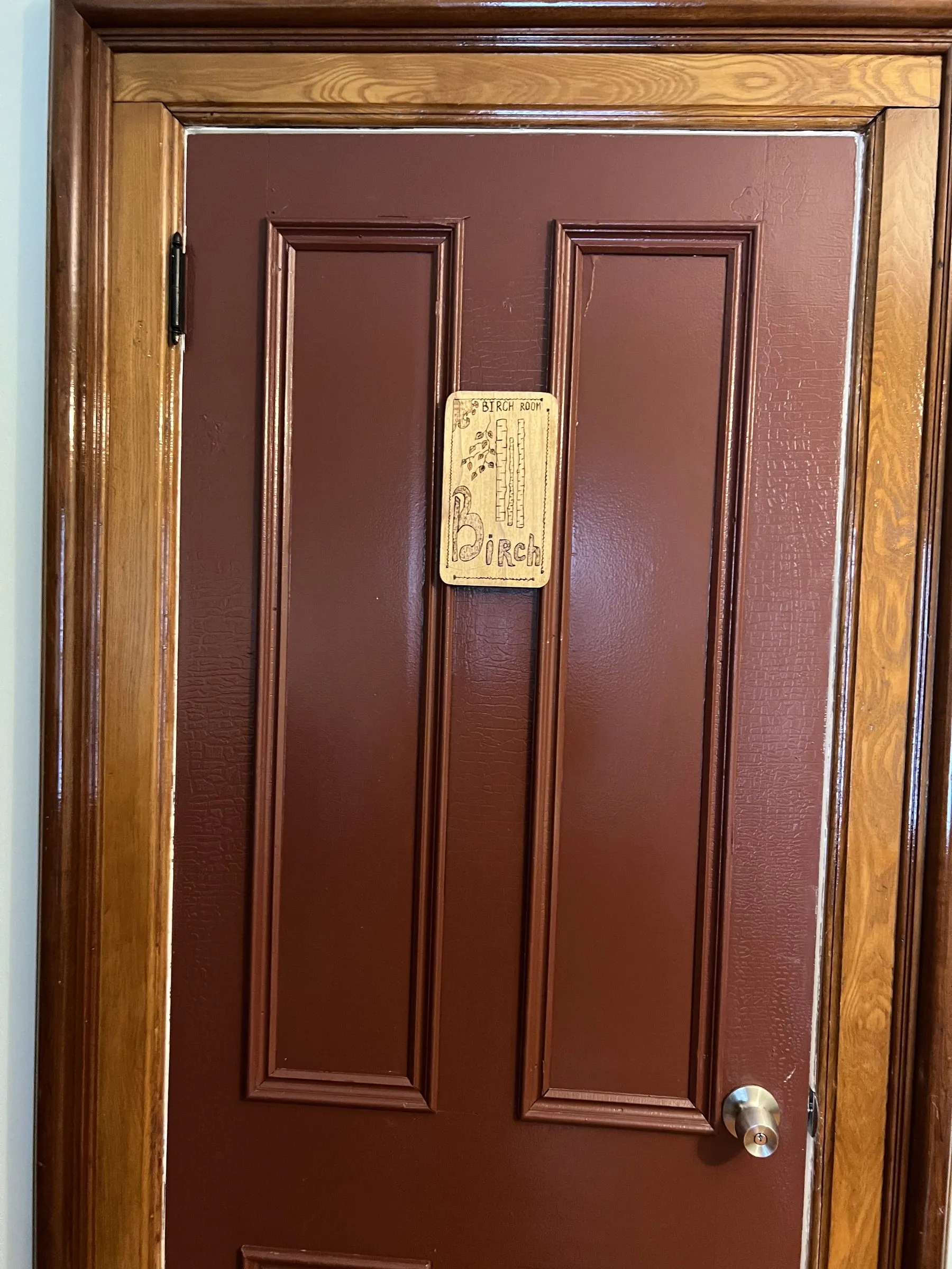 The carved plaque on the door